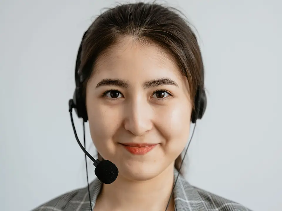 Smiling support agent wearing a headset